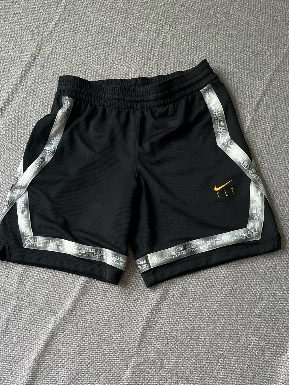 Nike Black Shorts with Silver Trim and Gold Swoosh